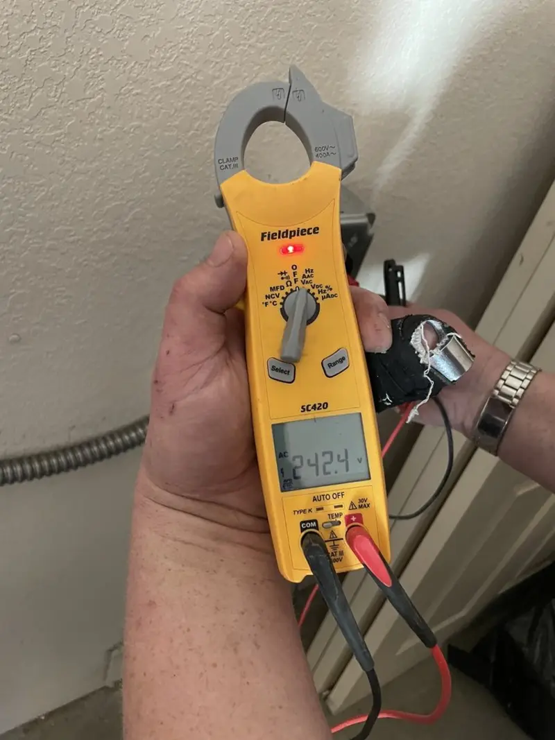 Voltage testing with clamp meter during Generator Installation in Parkland